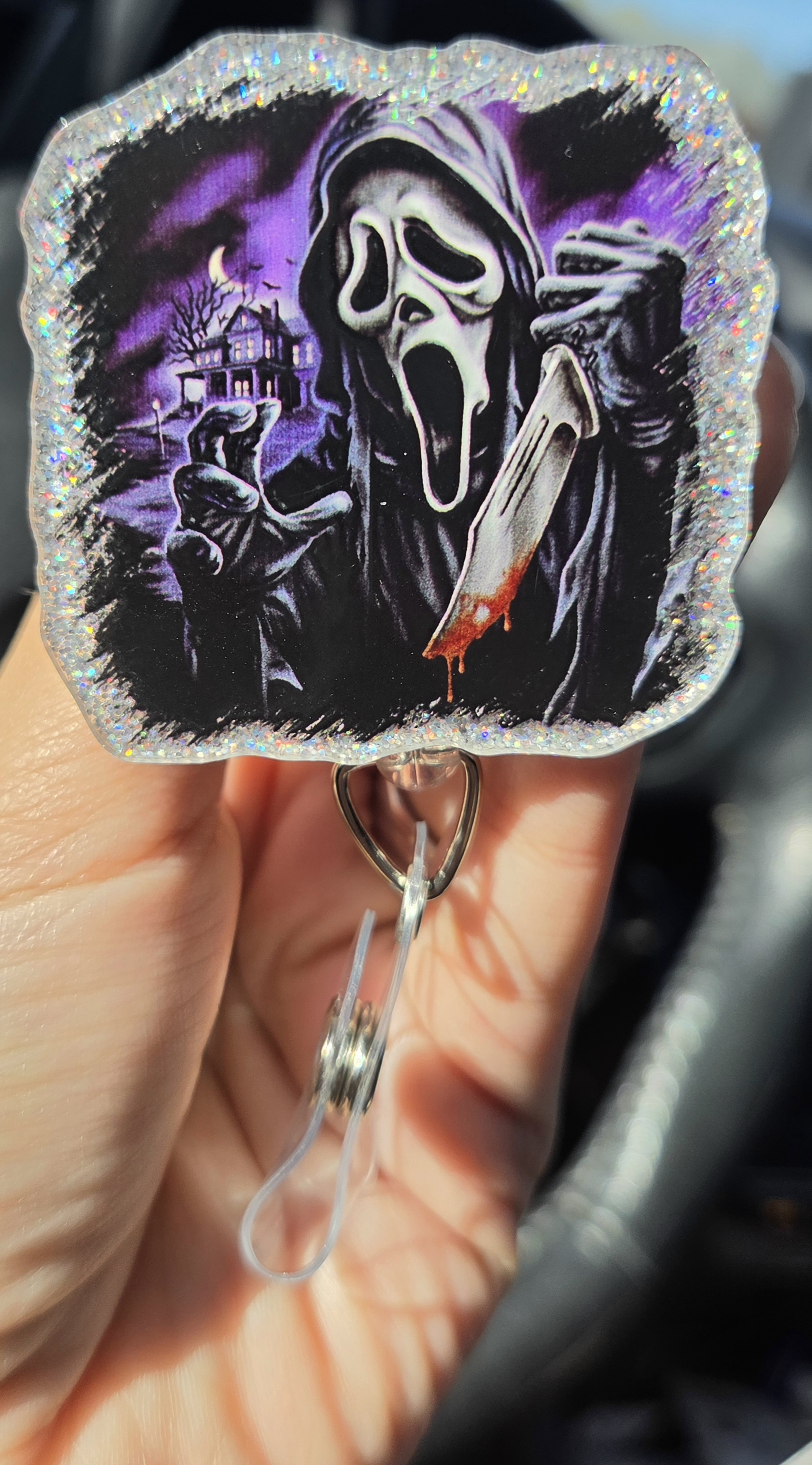 Silver and purple ghost face badgereel